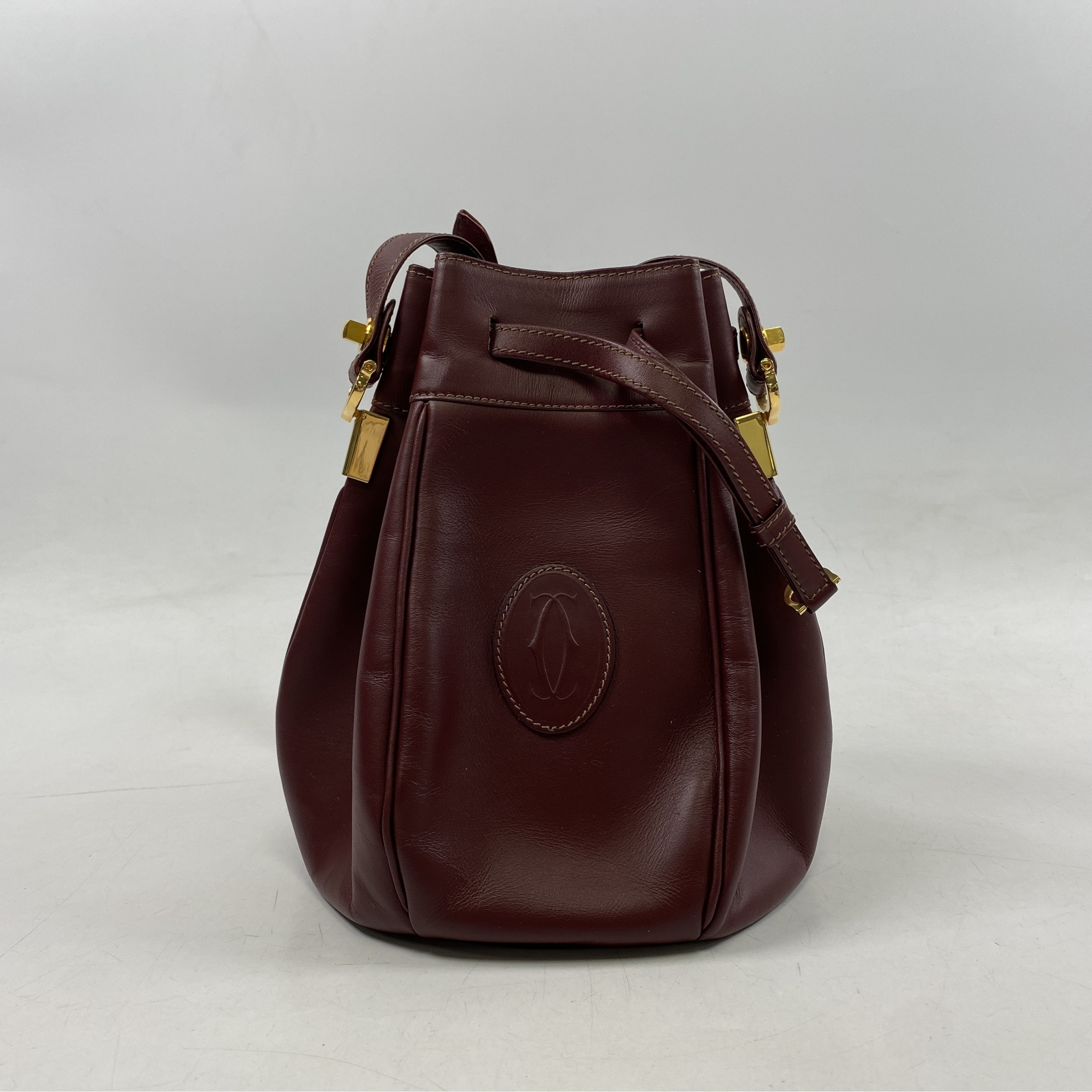 カルティエ マストライン 巾着ショルダーバッグ ボルドー レザー 買取