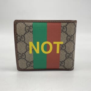 グッチ GGスプリーム FAKE/NOT プリント二つ折り財布 茶 PVC 636167 買取実績【買取日：2025年11月5日】